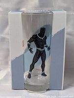 Glass in display box, front view showing Black Panther graphic