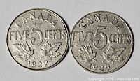 Obverse sides not shown; reverse sides of both coins visible with dates 1922 and 1929