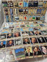 Binder pages showing rows of Desert Storm trading cards with leader portraits, equipment images and country maps