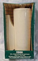 Front of boxed Dixie wall-mount cup dispenser