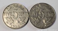 Both Canadian 5-cent coins obverse side showing dates 1934 and 1922