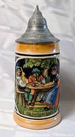 Full front view showing tavern scene and pewter lid