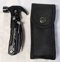 Multitool folded beside nylon sheath