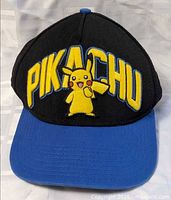Front view showing Pikachu embroidery and blue brim