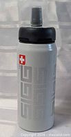 Full view of SIGG bottle front showing logo and cap