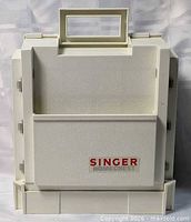 Front view of closed Singer Home Chest case with handle