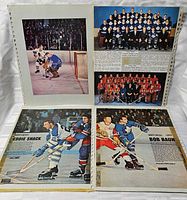 Overview of four cutout pages in plastic sleeves