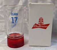 Mug and box side by side showing graphics and red base