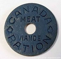 Obverse view showing full text Canada Meat Viande Ration and maple leaves
