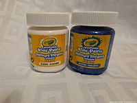 Front view showing both paint jars and labels