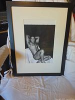 Front view of framed photograph showing artwork, mat, and frame