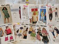 All 12 sewing pattern envelopes displayed