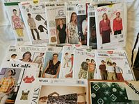 All 20 sewing patterns spread out to show variety of brands and garment types