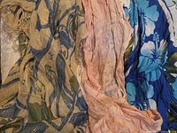 All three scarves showing colors, patterns and fringe
