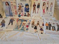 Front view of all 10 pattern envelopes laid out on bed
