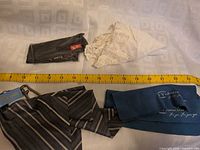 All items laid out with measuring tape for scale