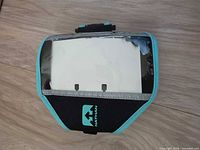 Front view showing Nathan logo, clear window, teal trim