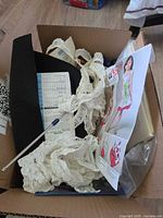 Box contents overview with lace, pattern envelope, black sheet