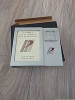 Front view showing photo opening, clock, logo