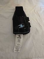 Full view of the ankle brace showing straps and tag