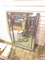 Full view of rectangular beaded frame mirror leaning against wall
