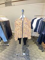 Full view of chrome garment rack with casters