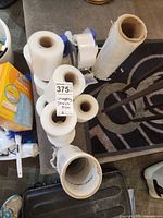 Top view showing multiple stretch wrap rolls, packing tape, dispenser, core inserts