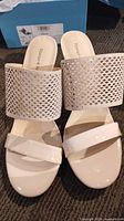 Top view of pair showing perforated strap design and toe strap