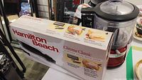 Boxed Hamilton Beach electric knife beside KitchenAid mini chopper