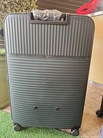 Front view of MAT ribbed hardshell suitcase