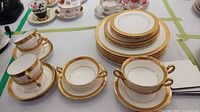 Group view of plates, cups, saucers showing pattern and counts