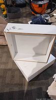 Both white laminate pedestals showing size and condition