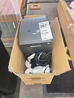 Printer, cables and label rolls inside box