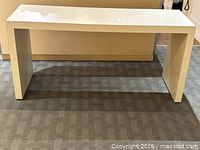 Front view of entire white laminate Parsons console table