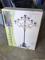 Box showing image of assembled 7-arm floor candelabrum