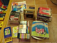 Overall lot showing cassette player, cassettes, books
