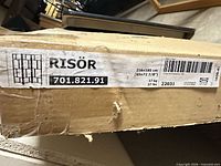 Box label showing RISÖR model, barcode, size 216×185 cm (85×72-7/8 in), weight 17 kg/37 lb, model 701.821.91