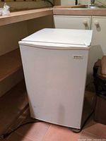 Front view of closed Magic Chef compact refrigerator