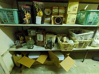 Shelving with boxed Diamond F lanterns, ceiling light boxes, loose fixtures