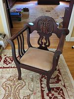Full view of armchair on rug