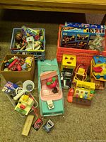 Overview of crates and larger toys on carpet