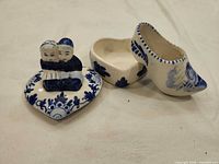 Mini clog, heart-shaped trinket box base and figurine lid displayed together