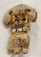 Front view showing dog design, rhinestone eyes and collar