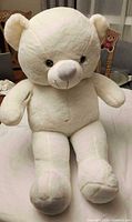 Front view of white plush teddy bear