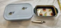 Pan with lid, ceramic dish, corkscrew overview