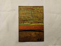Front view of mixed-media painting showing abstract design and artist signature