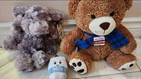 Group shot showing all three plush toys together