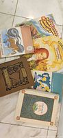 All six books laid out, showing covers and relative sizes