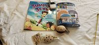 All five items laid out: book, die-cast car, Build Bonanza pack, two Scrumchums plush