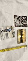 All three small art pieces with tape measure for scale